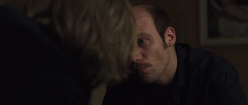 Movie still from “Bullhead” (2011), directed by Michaël R. Roskam – A man looking at himself in the mirror; Close Up shot, Over the shoulder angle