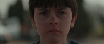 Movie still from “Bullhead” (2011), directed by Michaël R. Roskam – A young boy's face; Close Up shot, Low angle