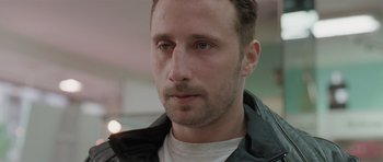 Movie still from “Bullhead” (2011), directed by Michaël R. Roskam – A person wearing a jacket; Close Up shot, Low angle