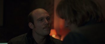 Movie still from “Bullhead” (2011), directed by Michaël R. Roskam – A man and a woman looking at one another; Close Up shot, Over the shoulder angle