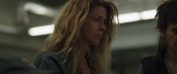 Movie still from “Bullhead” (2011), directed by Michaël R. Roskam – A person with long blonde hair; Close Up shot, Low angle