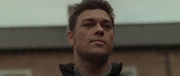 Movie still from “Bullhead” (2011), directed by Michaël R. Roskam – A person wearing a jacket; Close Up shot, Low angle