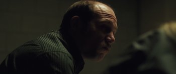 Movie still from “Bullhead” (2011), directed by Michaël R. Roskam – A person with a beard; Close Up shot, Low angle