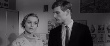 Movie still from “Bunny Lake Is Missing” (1965), directed by Otto Preminger – A man and a woman standing next to each other in a room; Close Up shot, Low angle