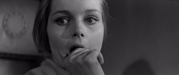 Movie still from “Bunny Lake Is Missing” (1965), directed by Otto Preminger – A woman with her hands on her chin; Close Up shot, Low angle