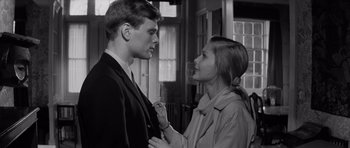 Movie still from “Bunny Lake Is Missing” (1965), directed by Otto Preminger – A man and a woman standing next to each other; Close Up shot, Low angle