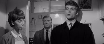 Movie still from “Bunny Lake Is Missing” (1965), directed by Otto Preminger – A black and white photo of two men standing next to each other; Close Up shot, Low angle