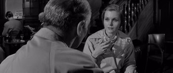 Movie still from “Bunny Lake Is Missing” (1965), directed by Otto Preminger – A man and a woman talking in front of a mirror; Close Up shot, Over the shoulder angle