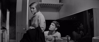 Movie still from “Bunny Lake Is Missing” (1965), directed by Otto Preminger – A man and a woman sitting in a bath tub; Medium shot, High angle