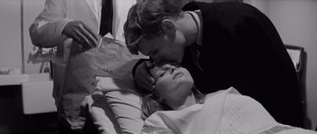 Movie still from “Bunny Lake Is Missing” (1965), directed by Otto Preminger – A man and a woman laying in a bed; Close Up shot, High angle
