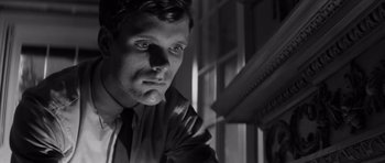 Movie still from “Bunny Lake Is Missing” (1965), directed by Otto Preminger – Black and white photograph of a man in a suit; Close Up shot, Low angle