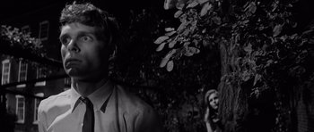 Movie still from “Bunny Lake Is Missing” (1965), directed by Otto Preminger – A black and white photo of a man and a woman; Close Up shot, Low angle