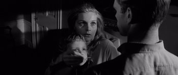 Movie still from “Bunny Lake Is Missing” (1965), directed by Otto Preminger – A woman and a child are looking at each other; Close Up shot, Over the shoulder angle