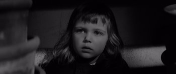 Movie still from “Bunny Lake Is Missing” (1965), directed by Otto Preminger – A black and white photo of a young girl; Close Up shot, High angle