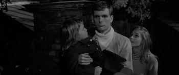 Movie still from “Bunny Lake Is Missing” (1965), directed by Otto Preminger – A man and a little girl are looking at each other; Close Up shot, High angle