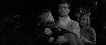 Movie still from “Bunny Lake Is Missing” (1965), directed by Otto Preminger – A man holding a little girl in his arms; Close Up shot, Low angle