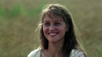 Movie still from “Burnt by the Sun” (1994), directed by Nikita Mikhalkov – A person smiling for the camera; Close Up shot, Low angle