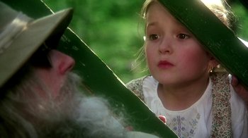 Movie still from “Burnt by the Sun” (1994), directed by Nikita Mikhalkov – A little girl looking at an older man; Close Up shot, Over the shoulder angle