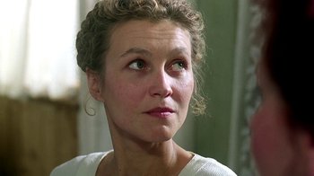 Movie still from “Burnt by the Sun” (1994), directed by Nikita Mikhalkov – A person looking up at the sky; Close Up shot, Low angle