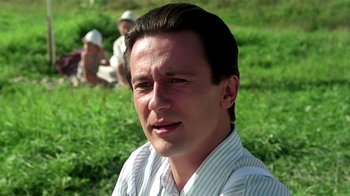 Movie still from “Burnt by the Sun” (1994), directed by Nikita Mikhalkov – A person wearing a striped shirt; Close Up shot, Low angle