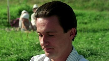 Movie still from “Burnt by the Sun” (1994), directed by Nikita Mikhalkov – A person wearing a shirt; Close Up shot, Low angle