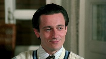 Movie still from “Burnt by the Sun” (1994), directed by Nikita Mikhalkov – A person wearing a sweater; Close Up shot, Low angle