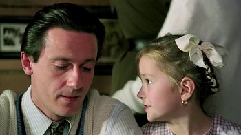 Movie still from “Burnt by the Sun” (1994), directed by Nikita Mikhalkov – A man and a little girl looking at each other; Close Up shot, Over the shoulder angle