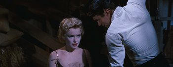 Movie still from “Bus Stop” (1956), directed by Joshua Logan – A man and a woman are looking at each other; Medium shot, Over the shoulder angle