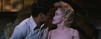 Movie still from “Bus Stop” (1956), directed by Joshua Logan – A man and a woman are kissing each other; Close Up shot, Over the shoulder angle