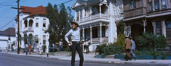 Movie still from “Bus Stop” (1956), directed by Joshua Logan – A man standing on the side of the street; Wide shot, Low angle