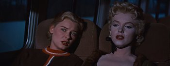 Movie still from “Bus Stop” (1956), directed by Joshua Logan – A couple of women sitting next to each other on a couch; Close Up shot, Low angle