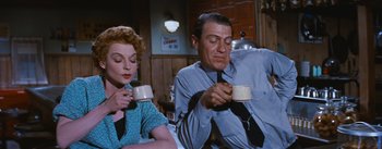 Movie still from “Bus Stop” (1956), directed by Joshua Logan – A man and a woman sitting at a table drinking coffee; Medium shot, Low angle