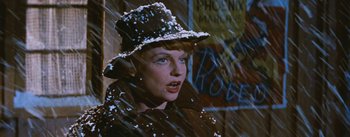 Movie still from “Bus Stop” (1956), directed by Joshua Logan – A woman wearing a hat with snow on it; Close Up shot, Low angle