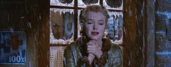 Movie still from “Bus Stop” (1956), directed by Joshua Logan – A person holding their hands in front of their face; Close Up shot, Low angle