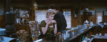 Movie still from “Bus Stop” (1956), directed by Joshua Logan – A man and a woman drinking coffee at a bar; Medium shot, Over the shoulder angle