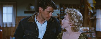 Movie still from “Bus Stop” (1956), directed by Joshua Logan – A man and a woman looking at one another; Medium shot, Over the shoulder angle