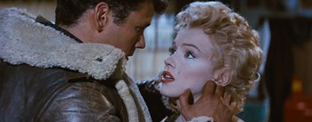 Movie still from “Bus Stop” (1956), directed by Joshua Logan – A man and a woman face to face in a scene; Close Up shot, Over the shoulder angle