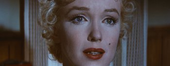 Movie still from “Bus Stop” (1956), directed by Joshua Logan – The face of a woman with red lipstick; Close Up shot, Over the shoulder angle