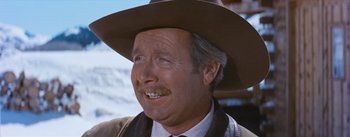 Movie still from “Bus Stop” (1956), directed by Joshua Logan – An older man wearing a brown hat and a suit; Close Up shot, Low angle