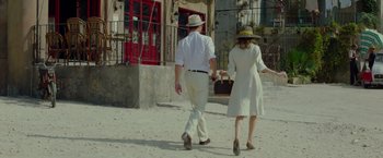 Movie still from “By the Sea” (2015), directed by Angelina Jolie – A man and a woman walking down a street; Wide shot, Low angle