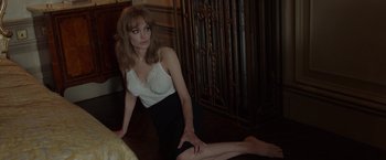 Movie still from “By the Sea” (2015), directed by Angelina Jolie – A woman sitting on the ground in a room; Medium shot, High angle