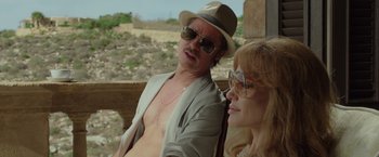Movie still from “By the Sea” (2015), directed by Angelina Jolie – A man and a woman sitting next to each other on a bench; Close Up shot, Over the shoulder angle