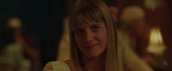 Movie still from “By the Sea” (2015), directed by Angelina Jolie – A person with long blonde hair; Close Up shot, Over the shoulder angle