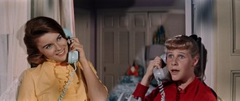 Movie still from “Bye Bye Birdie” (1963), directed by George Sidney – Two women are talking to each other on the phone; Medium shot, Low angle