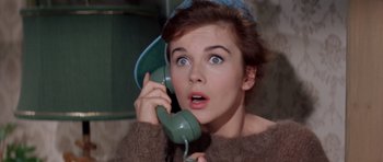 Movie still from “Bye Bye Birdie” (1963), directed by George Sidney – A woman holding a phone up to her ear; Close Up shot, High angle