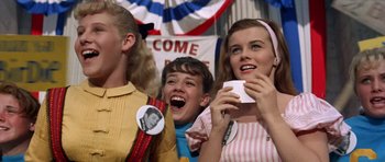 Movie still from “Bye Bye Birdie” (1963), directed by George Sidney – A group of young people standing next to each other; Medium shot, Low angle