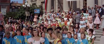 Movie still from “Bye Bye Birdie” (1963), directed by George Sidney – A crowd of people standing in front of a building; Wide shot, High angle