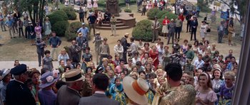 Movie still from “Bye Bye Birdie” (1963), directed by George Sidney – A crowd of people gathered in a park to watch a performance; Extreme Wide shot, High angle