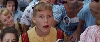 Movie still from “Bye Bye Birdie” (1963), directed by George Sidney – A young girl with her mouth open looking surprised; Close Up shot, High angle