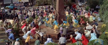 Movie still from “Bye Bye Birdie” (1963), directed by George Sidney – A crowd of people sitting and standing around a statue; Extreme Wide shot, High angle